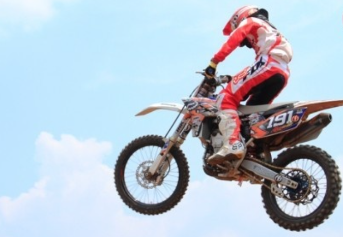 Dirt Bike - Performing jumps, turns, and technical maneuvers